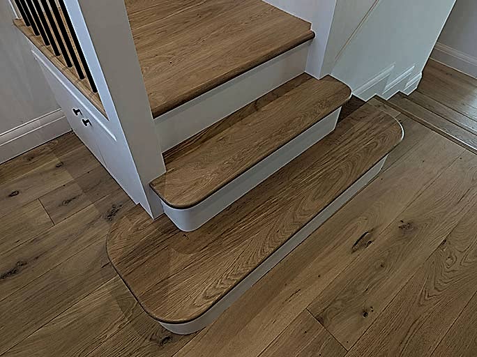 Custom made engineered oak staircase in a naturally light oak colour #CraftedForLife